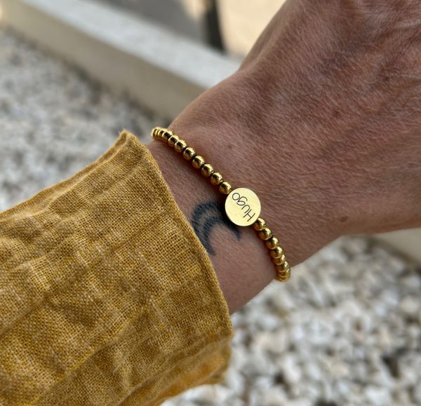 Pulsera de bolas y botón de acero